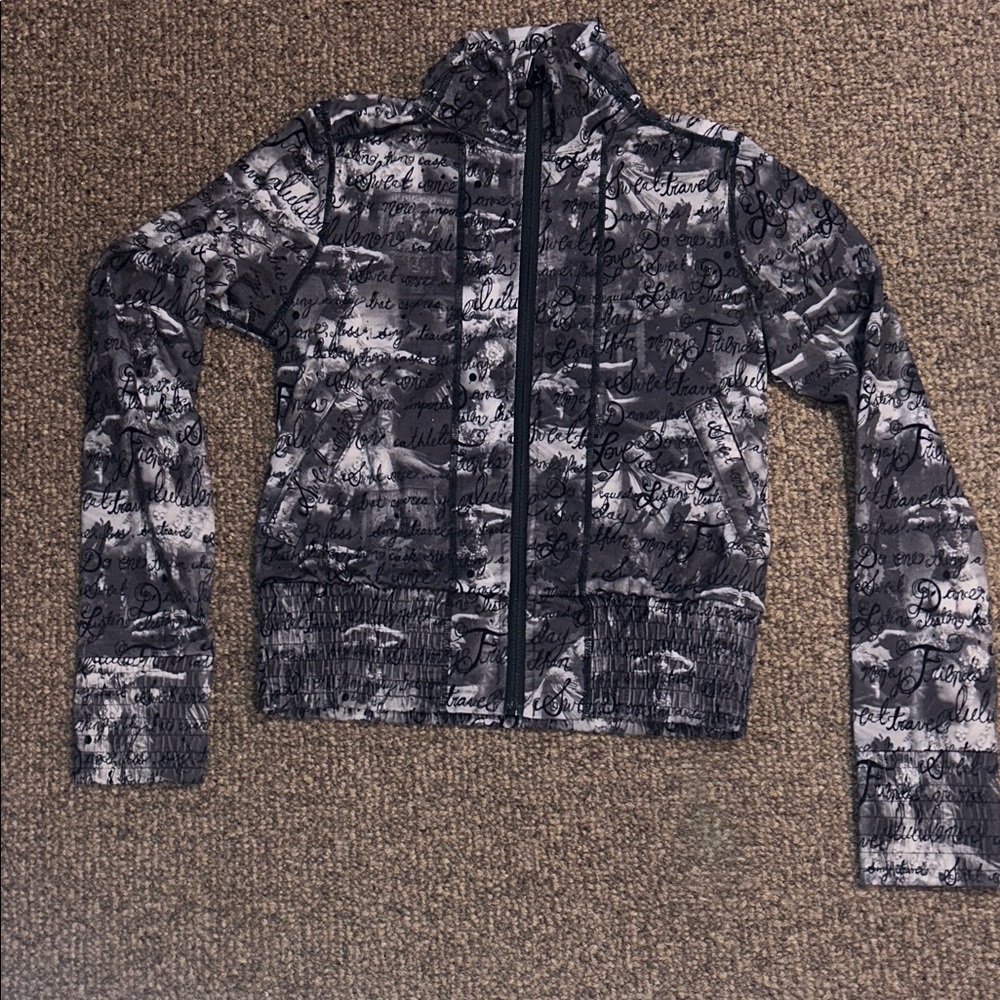 Lululemon jacket, zip up jacket, gray, black, and white with cute little writing